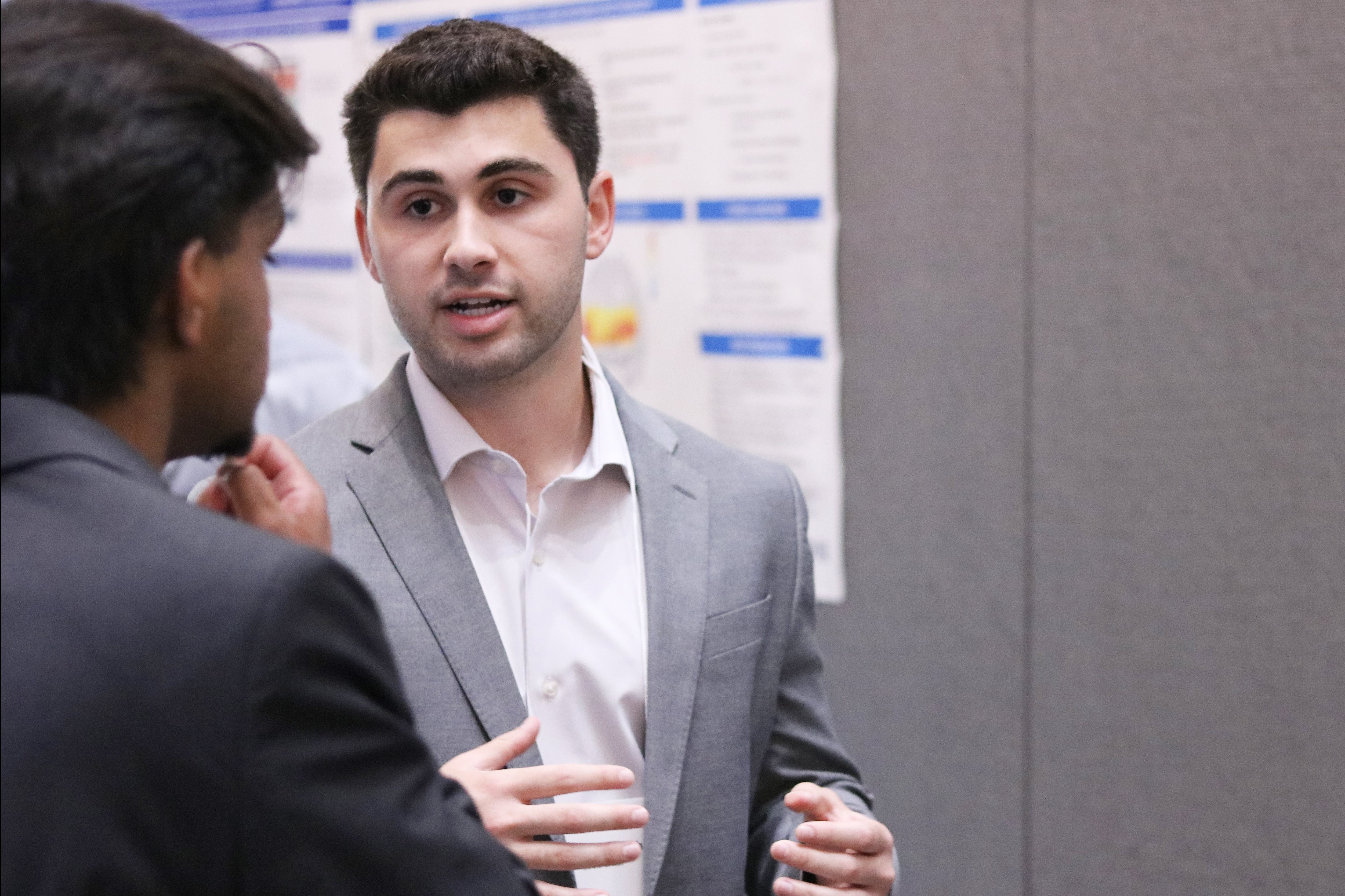 2025 CRISP scholar, Alex Yucht, presents at a poster session