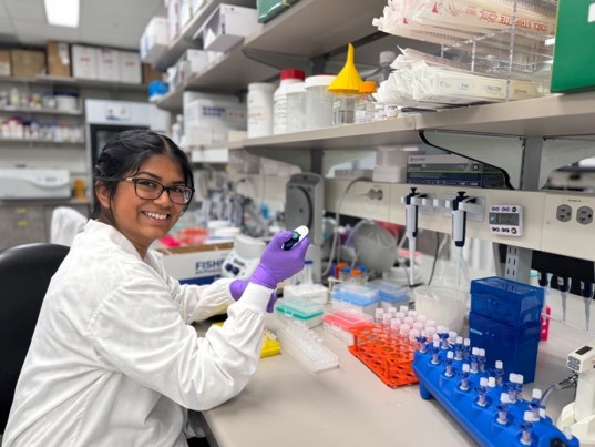 2025 SURF student Sharon Ignatius Newton sits in Mayo Clinic lab