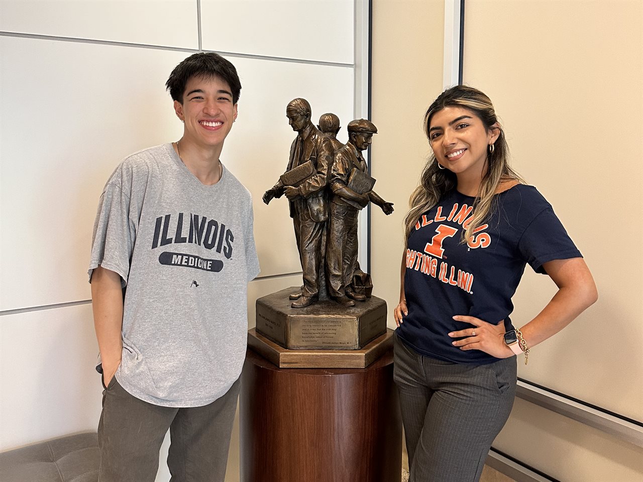 HERE 2023 Cohort Isela and Brandon standing near a statue at Mayo Clinic.